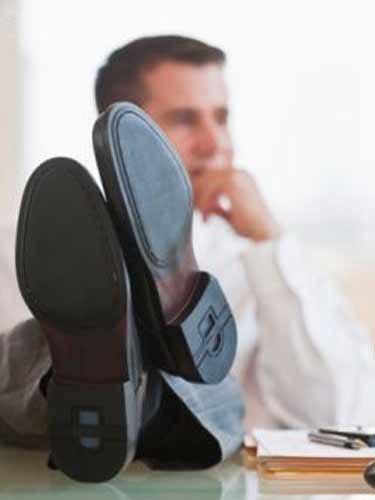 Foto angajat relaxat (c) Gettyimages