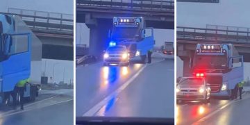 Polițist filmat în timp ce îndreaptă pistolul spre un şofer de TIR